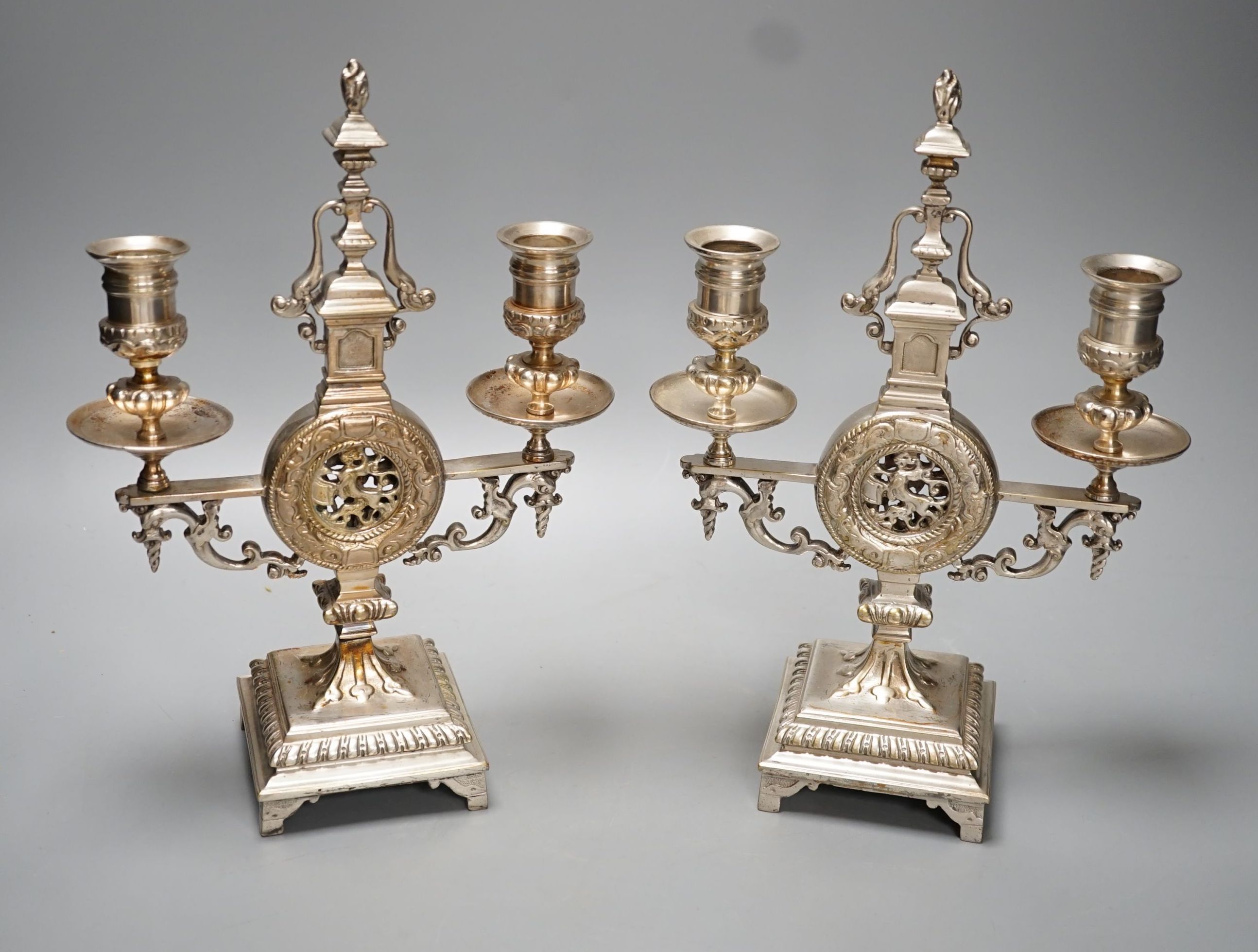 A pair of Winn & Co., Birmingham silvered brass two branch candelabra - 28.9cm high